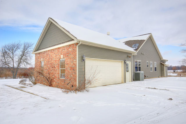 8038 Adam Road Weldon, IL 61882 - Photo 7 of 53 a view of a house with a snow in the yard