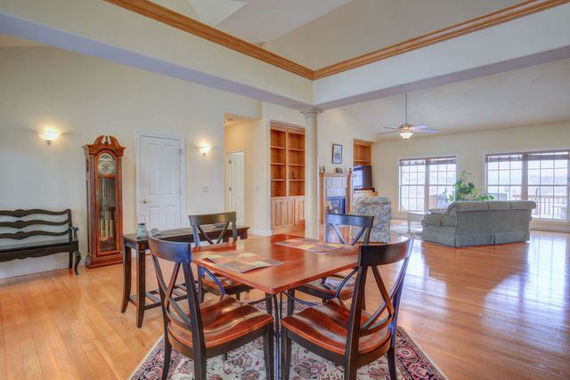 8038 Adam Road Weldon, IL 61882 - Photo 10 of 53 a view of a dining room with furniture and wooden floor
