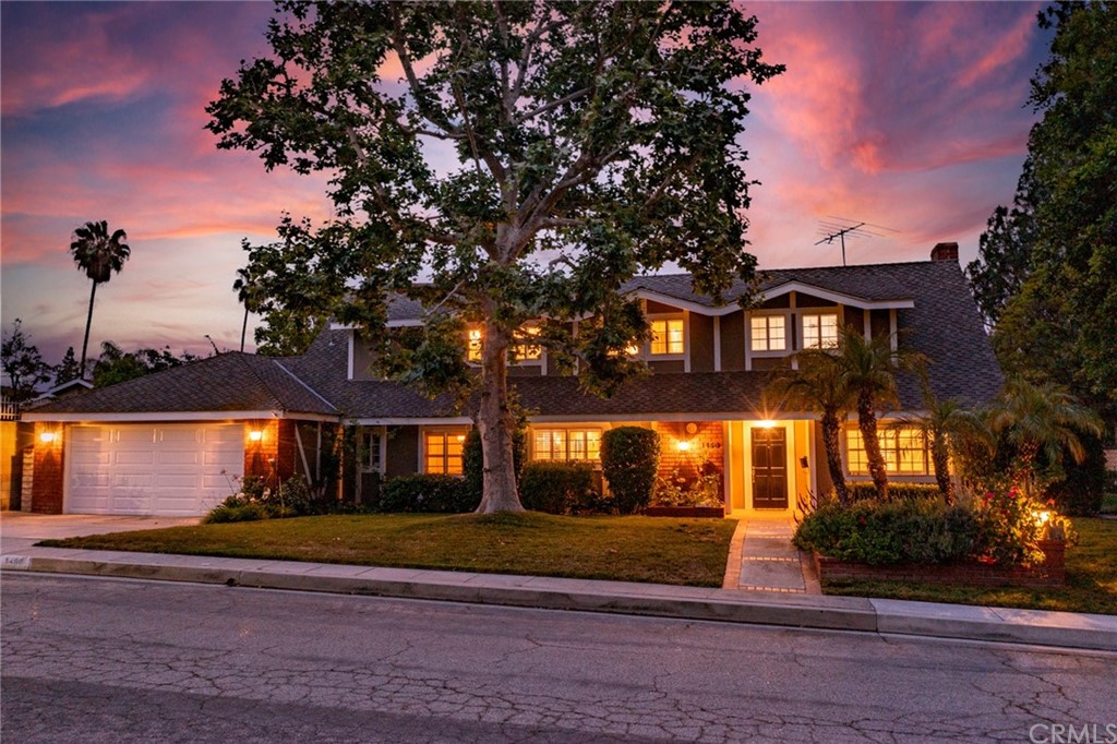 a view of house with yard