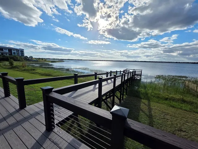 a view of a balcony with lake view and mountain view