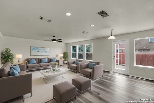a living room with furniture and a window