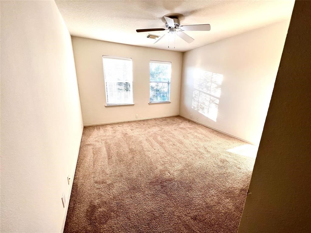 10219 Sugarbridge Trail Sugar Land, TX 77498 - Photo 11 of 16 a view of an empty room and a window