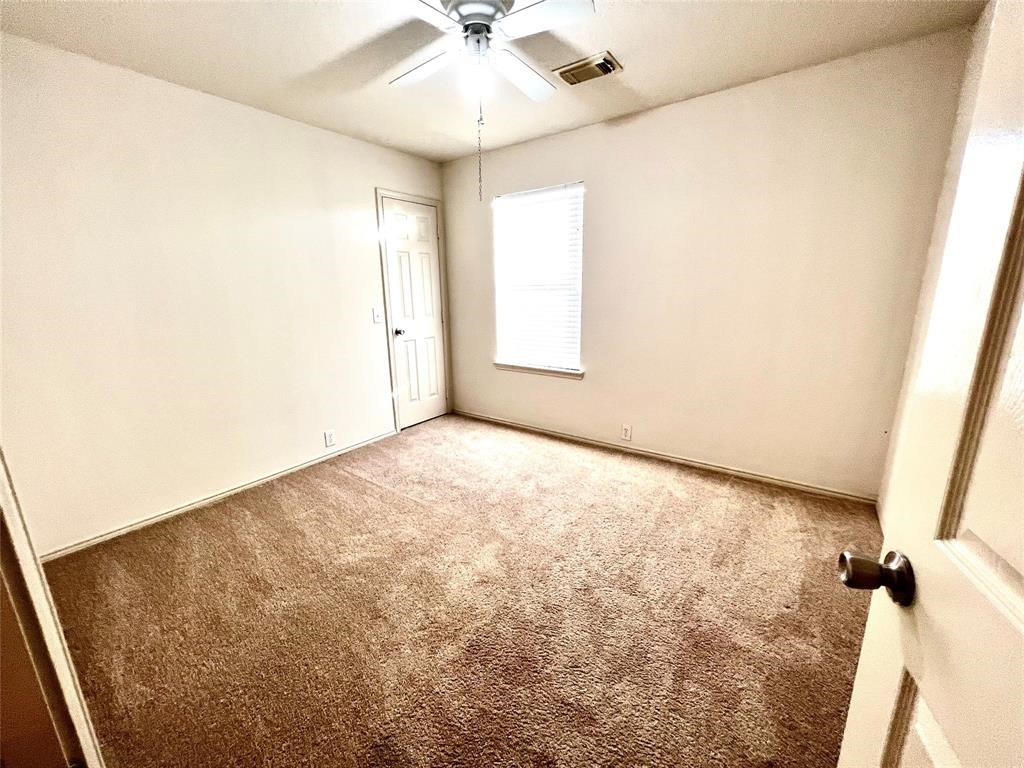 10219 Sugarbridge Trail Sugar Land, TX 77498 - Photo 13 of 16 an empty room with a window
