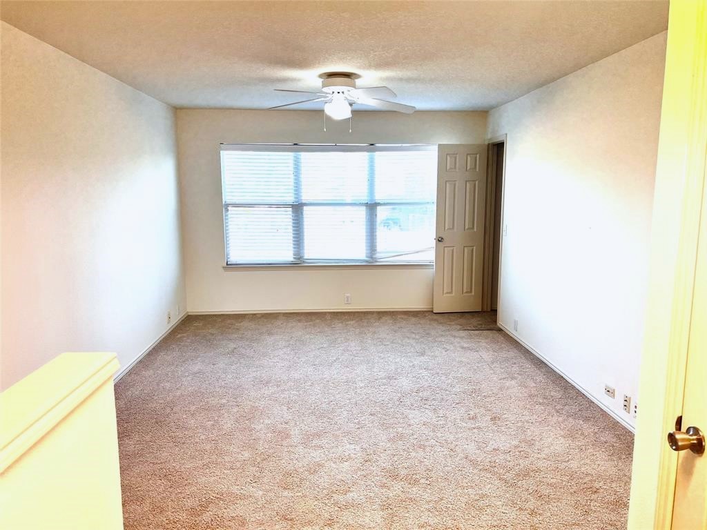 10219 Sugarbridge Trail Sugar Land, TX 77498 - Photo 14 of 16 an empty room with a window