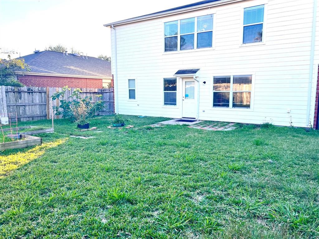 10219 Sugarbridge Trail Sugar Land, TX 77498 - Photo 16 of 16 a view of a house with a yard and sitting area