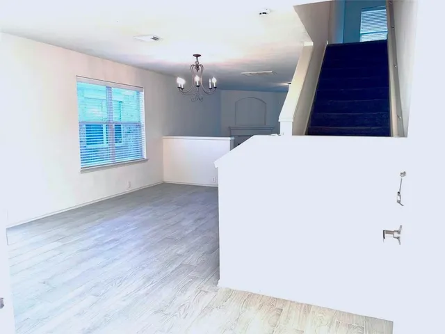 a view of a livingroom with wooden floor