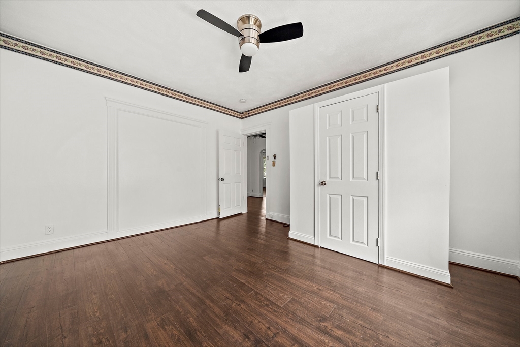 62 Favre Street, Unit 2 Boston, MA 02126 - Photo 17 of 24 a view of an empty room with wooden floor