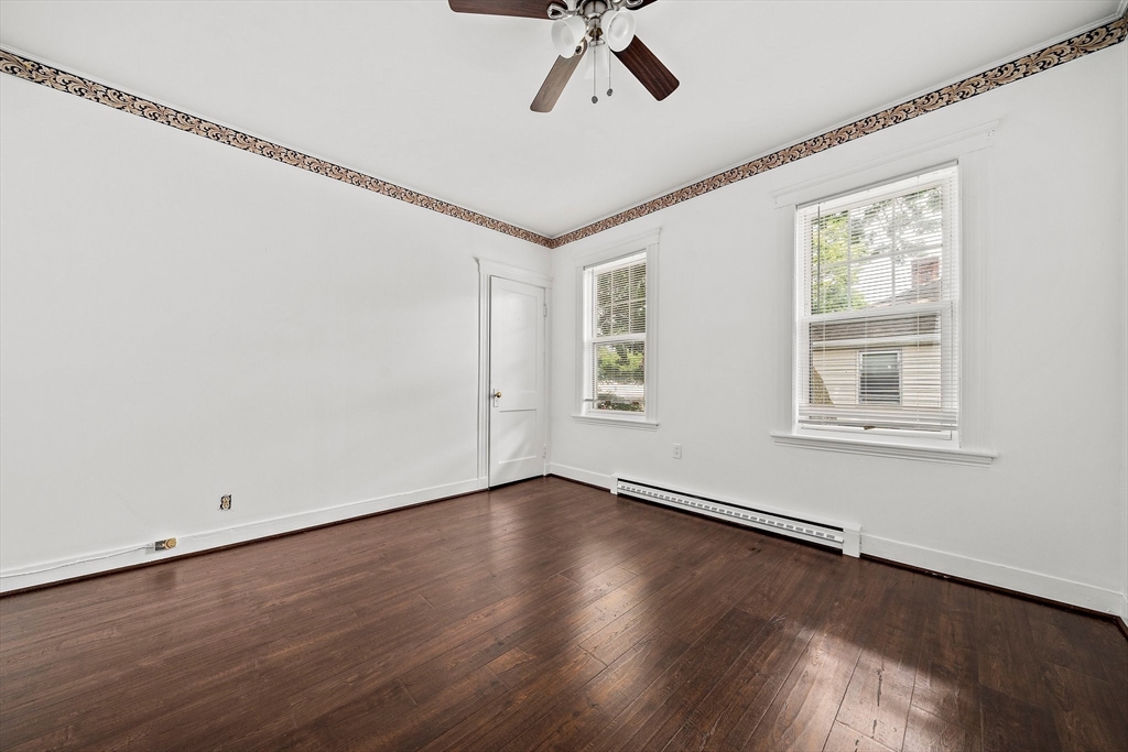 62 Favre Street, Unit 2 Boston, MA 02126 - Photo 20 of 24 a view of empty room with wooden floor and fan