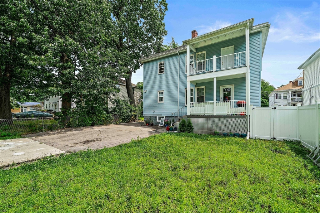 62 Favre Street, Unit 2 Boston, MA 02126 - Photo 22 of 24 a front view of house with yard and green space