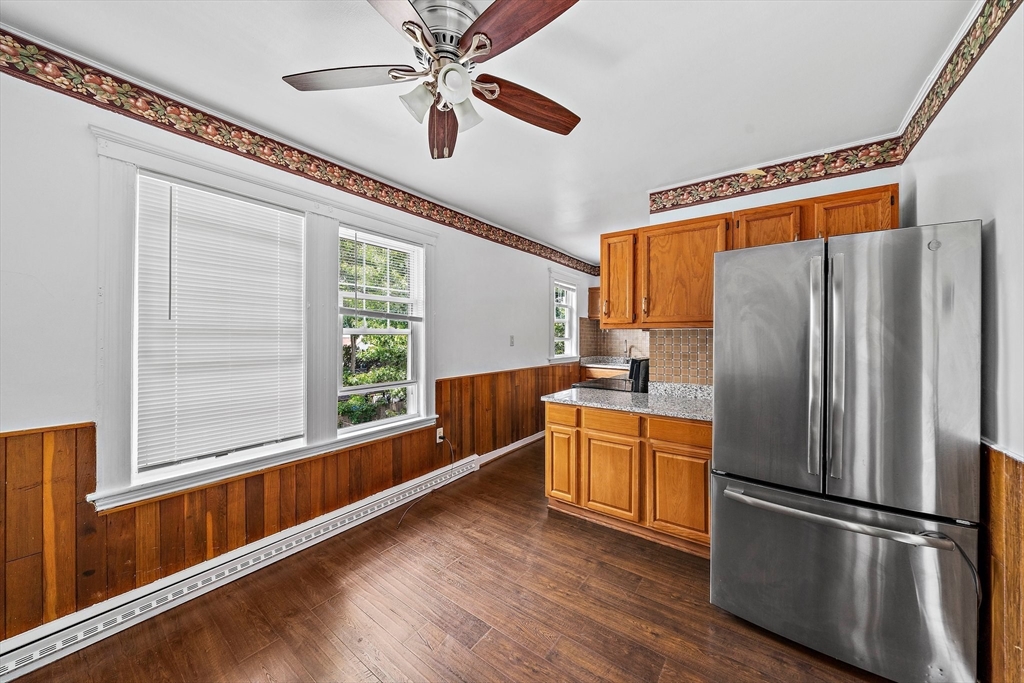 62 Favre Street, Unit 2 Boston, MA 02126 - Photo 6 of 24 a kitchen with stainless steel appliances a refrigerator and a window