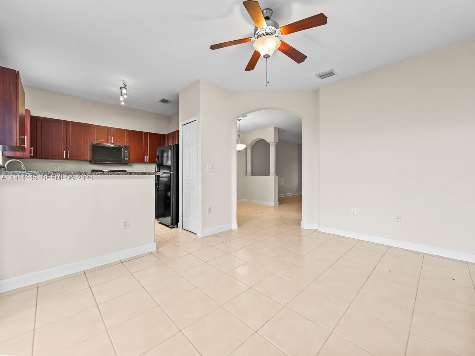 2441 Southeast 14 Street Homestead, FL 33035 - Photo 12 of 32 a view of a kitchen with a sink and a refrigerator