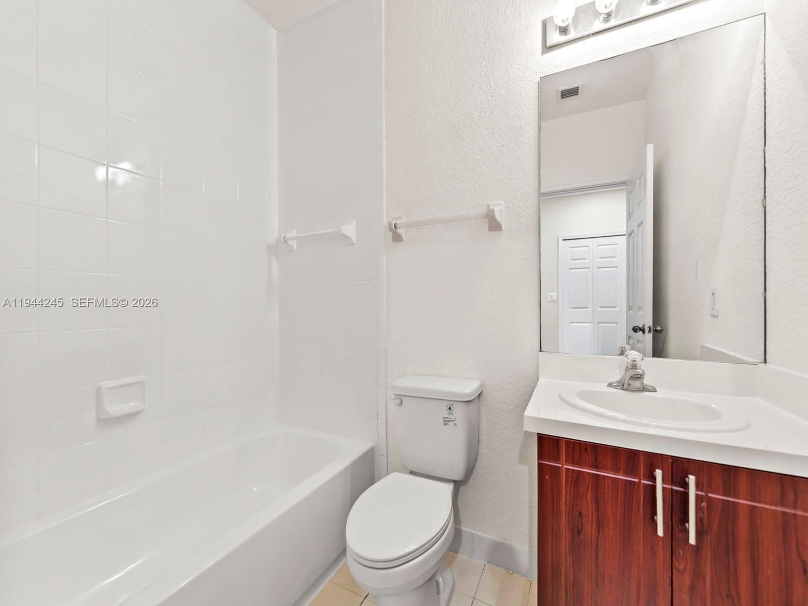 2441 Southeast 14 Street Homestead, FL 33035 - Photo 23 of 32 a bathroom with a sink a toilet and shower