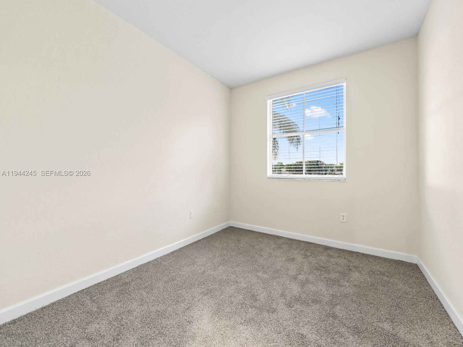 2441 Southeast 14 Street Homestead, FL 33035 - Photo 24 of 32 an empty room with a window