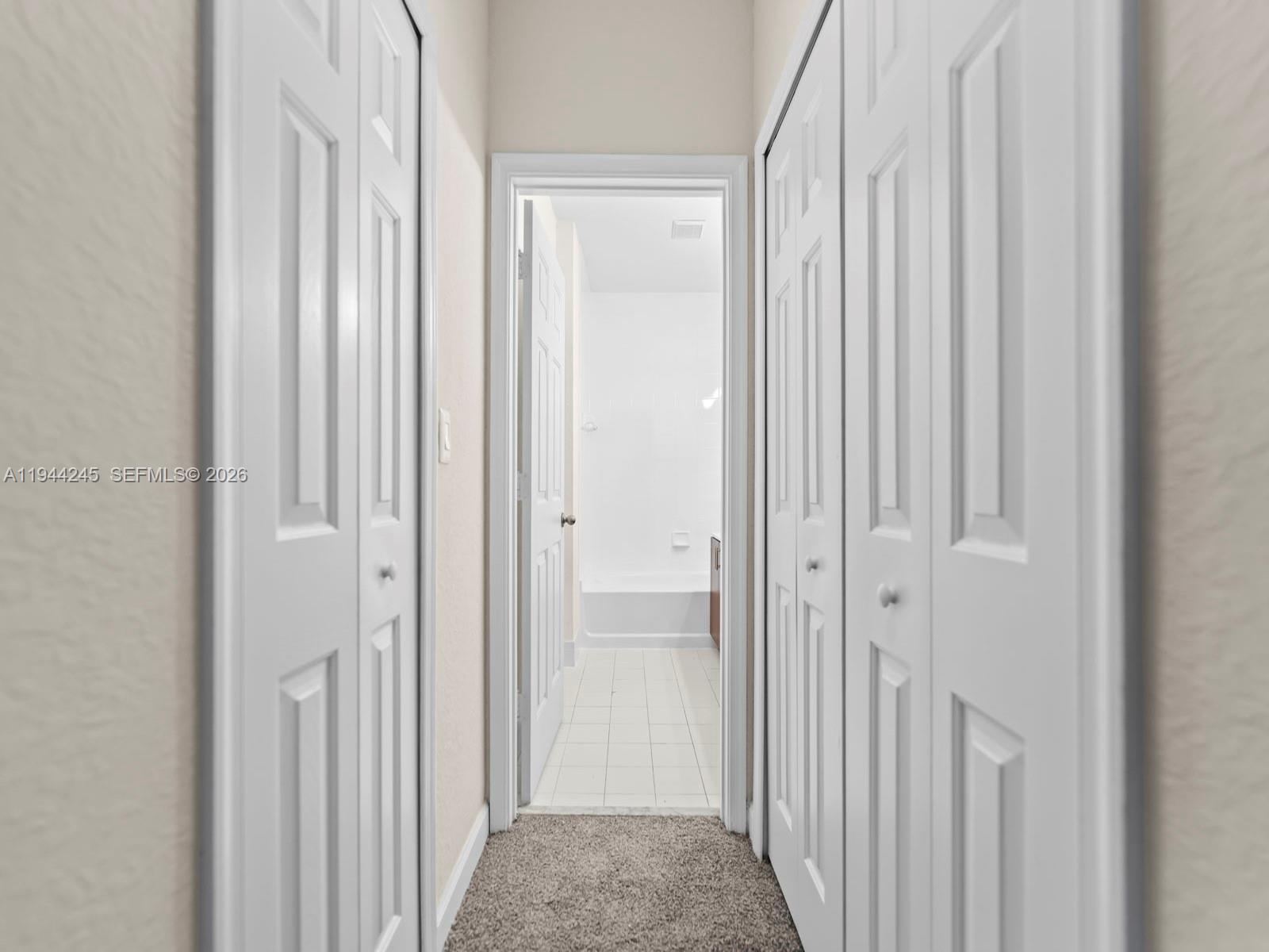 2441 Southeast 14 Street Homestead, FL 33035 - Photo 28 of 32 a view of a bathroom from the hallway