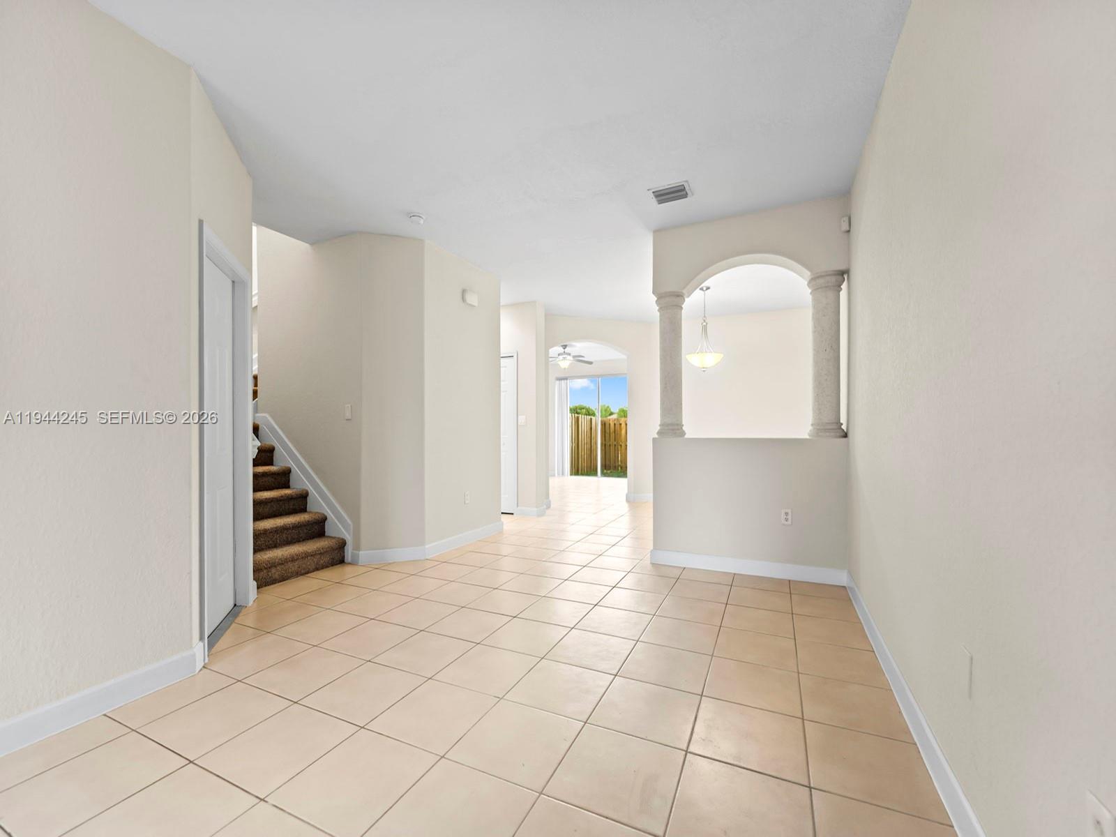 2441 Southeast 14 Street Homestead, FL 33035 - Photo 3 of 32 a view of a hallway view with staircase