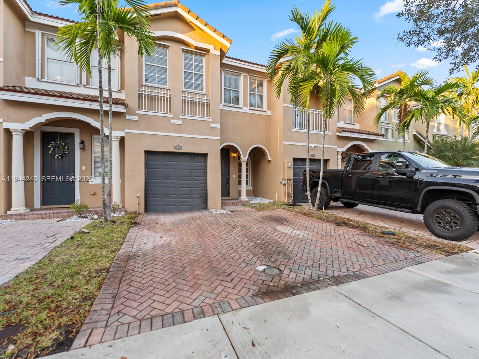 2441 Southeast 14 Street Homestead, FL 33035 - Photo 32 of 32 a front view of a house with a garden