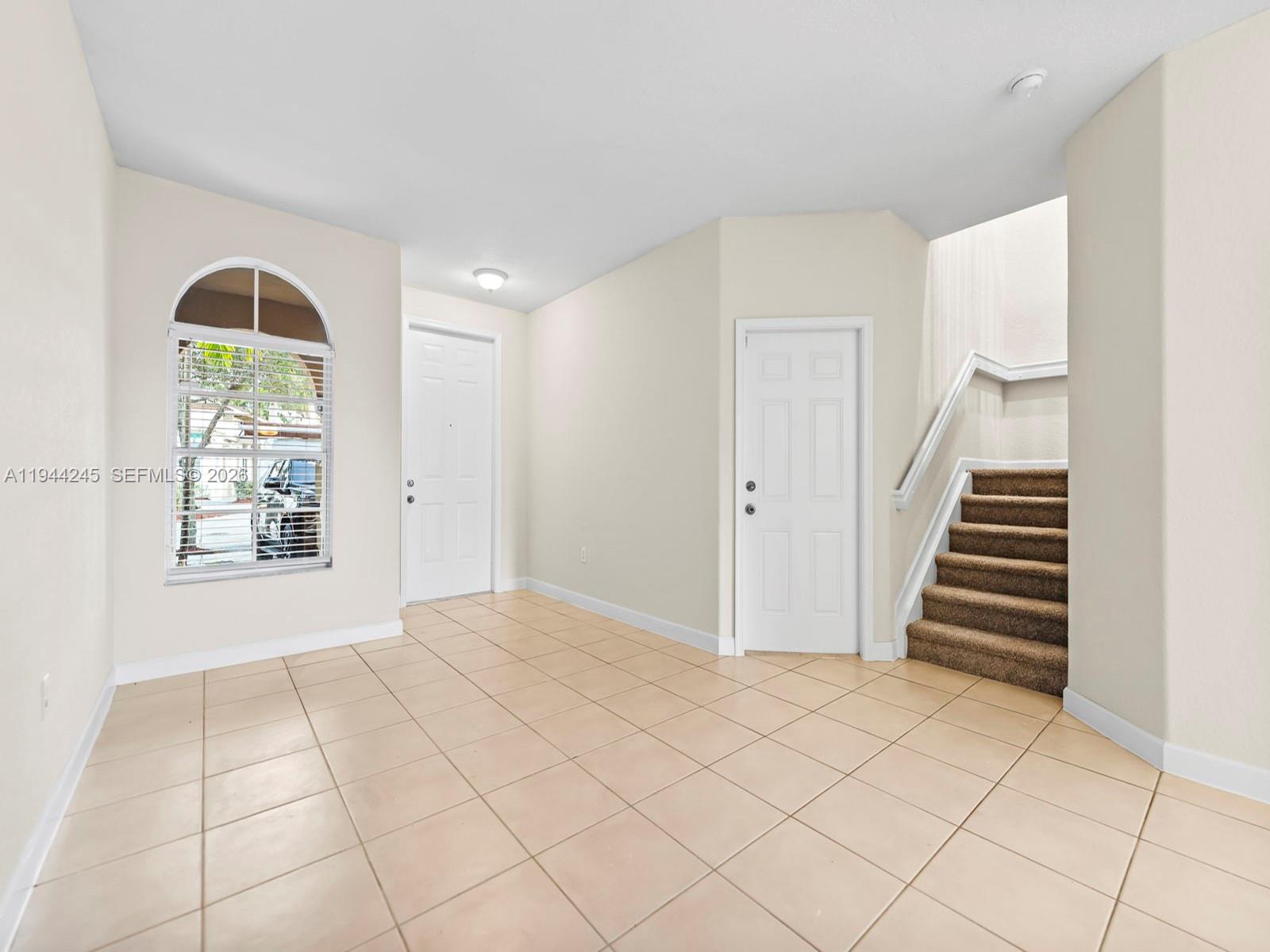 2441 Southeast 14 Street Homestead, FL 33035 - Photo 6 of 32 a view of an empty room with a window