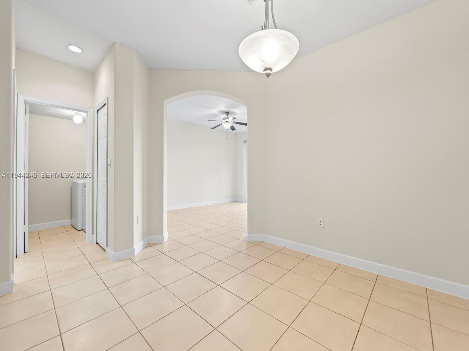 2441 Southeast 14 Street Homestead, FL 33035 - Photo 7 of 32 an empty room with wooden floor