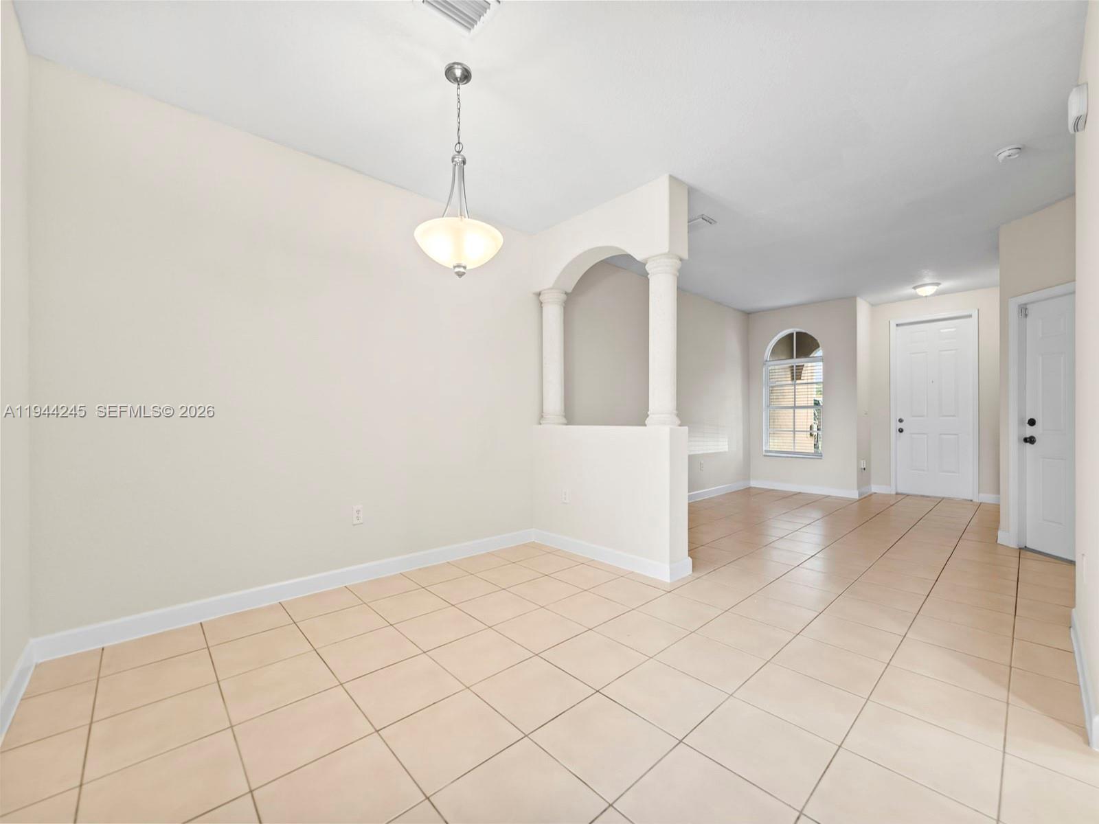 2441 Southeast 14 Street Homestead, FL 33035 - Photo 8 of 32 a view of an empty room and window