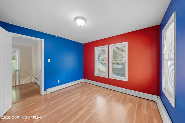a view of front door with wooden floor