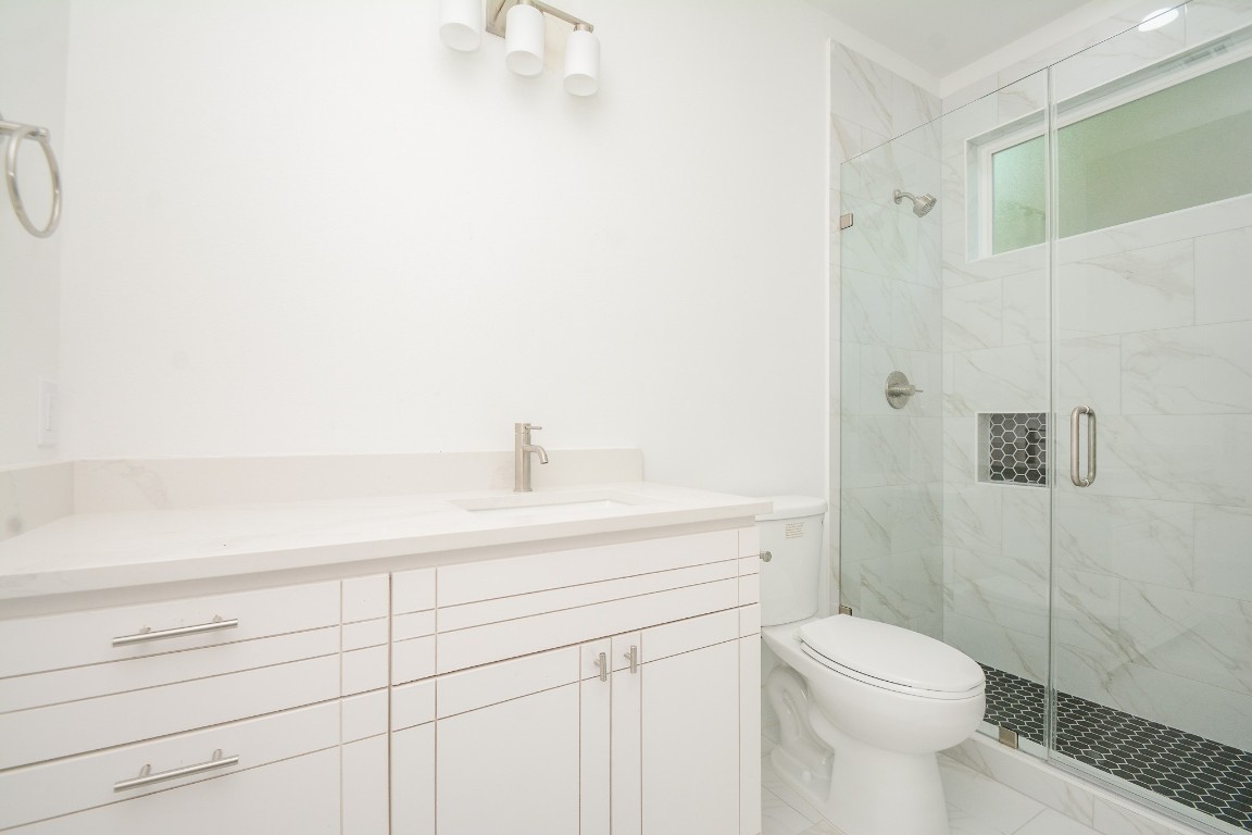 426 Sikes Street, Unit B Houston, TX 77018 - Photo 7 of 31 The full bathroom has a beautifully tiled, big shower!