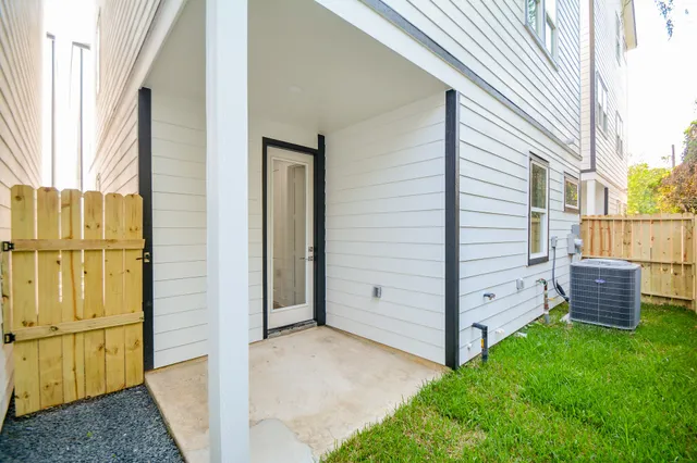 a view of a backyard with a sink and wooden fence