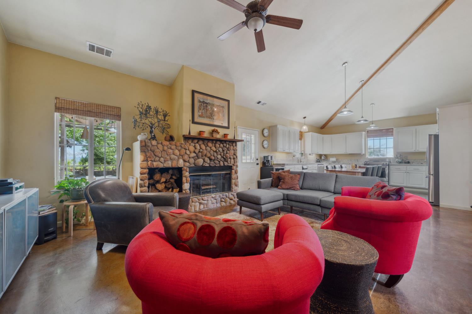 11321 New York Ranch Road Jackson, CA 95642 - Photo 14 of 73 a living room with furniture a fireplace and a large window