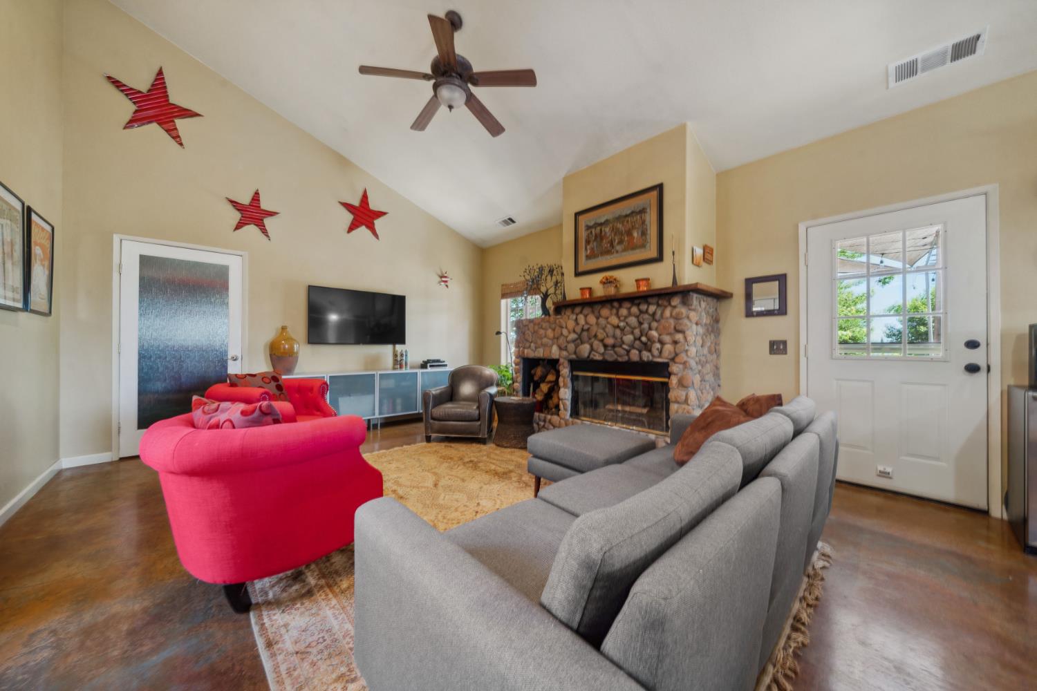11321 New York Ranch Road Jackson, CA 95642 - Photo 16 of 73 a living room with furniture and a flat screen tv