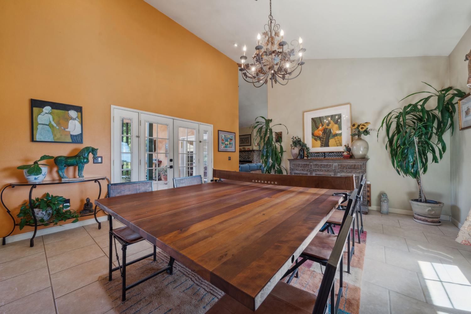 11321 New York Ranch Road Jackson, CA 95642 - Photo 19 of 73 a dining room with furniture a rug and wooden floor