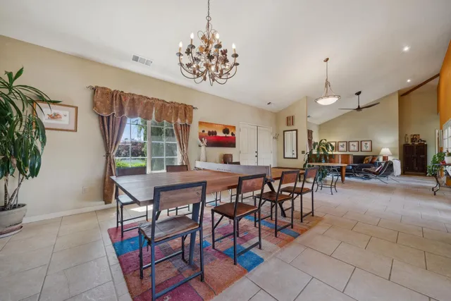 a living room with furniture a window and a flat screen tv