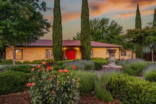 an aerial view of a house with a garden