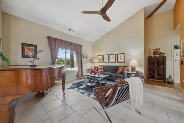 a bedroom with a large bed and a large window