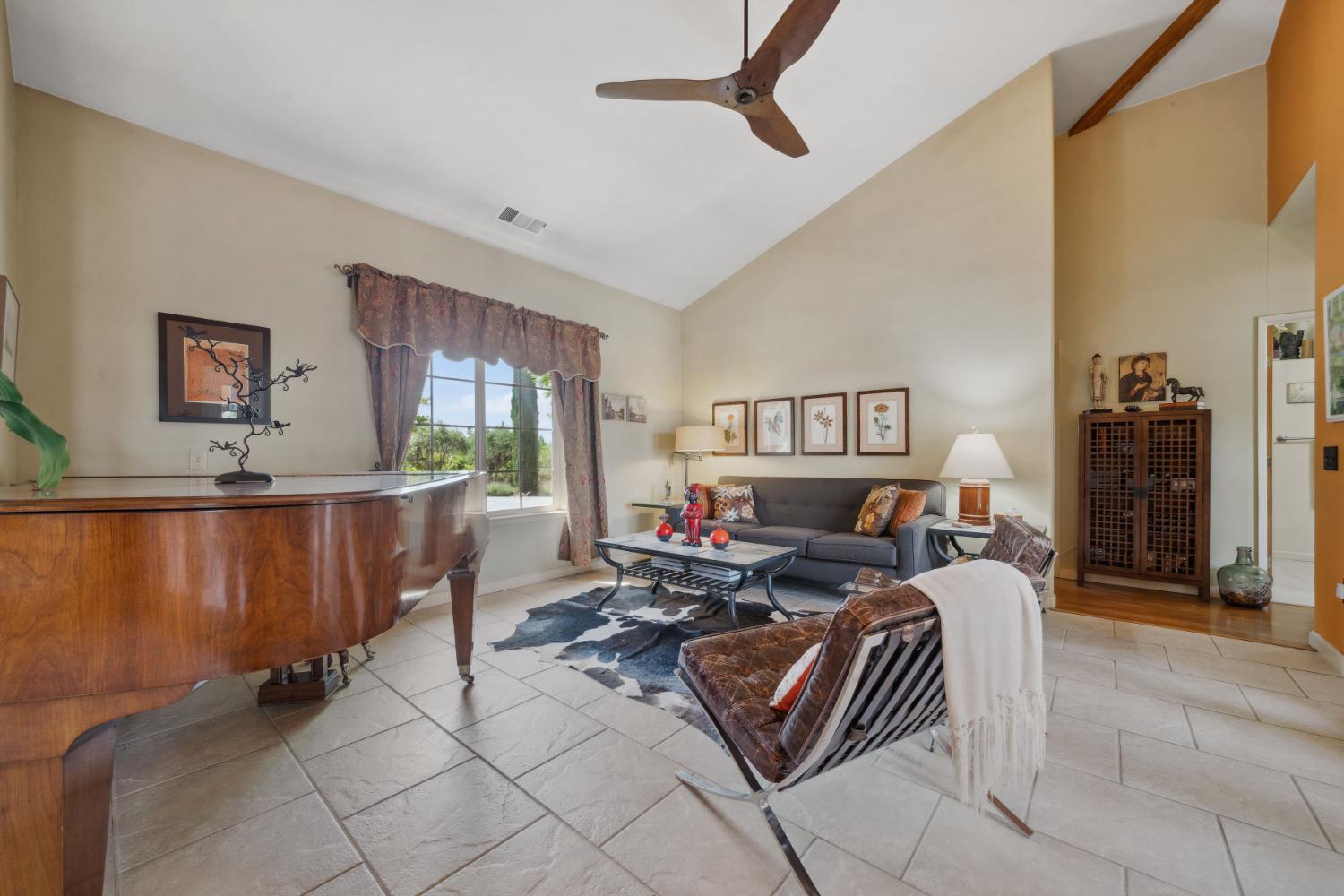 11321 New York Ranch Road Jackson, CA 95642 - Photo 22 of 73 a living room with furniture a window and a flat screen tv