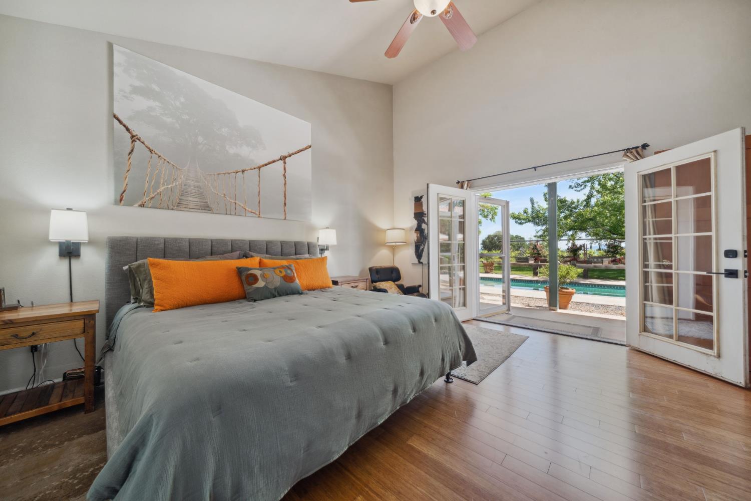 11321 New York Ranch Road Jackson, CA 95642 - Photo 24 of 73 a bedroom with a large bed and a large window