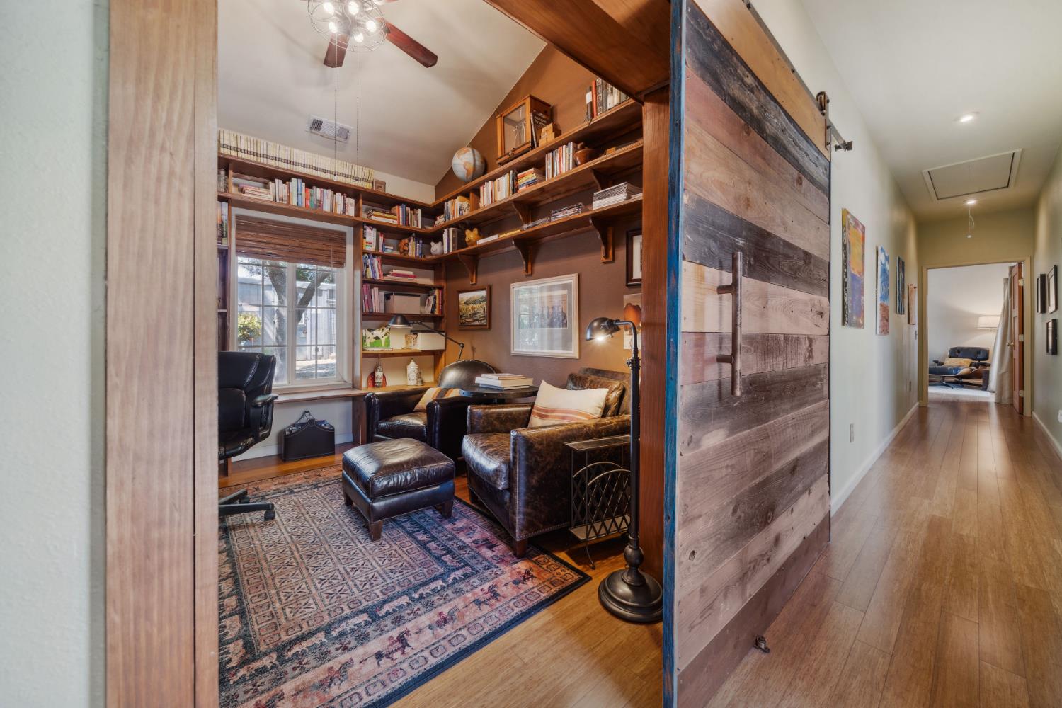 11321 New York Ranch Road Jackson, CA 95642 - Photo 28 of 73 a view of a hallway and wooden floor with a livingroom view
