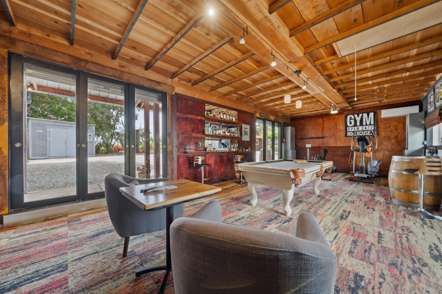11321 New York Ranch Road Jackson, CA 95642 - Photo 31 of 73 a living room with furniture and a chandelier