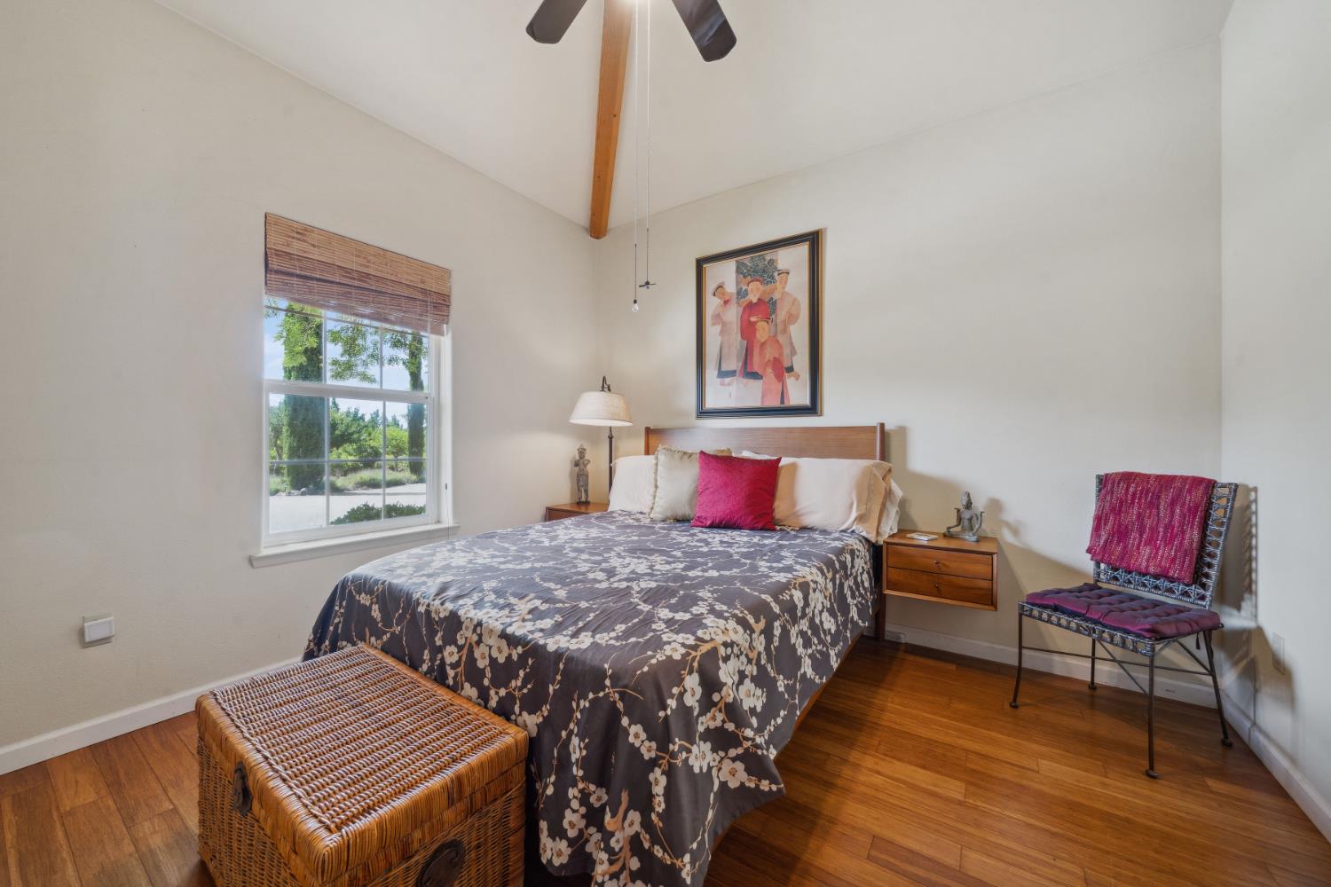 11321 New York Ranch Road Jackson, CA 95642 - Photo 32 of 73 a bedroom with a bed and wooden floor