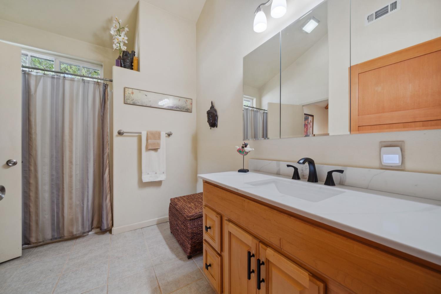 11321 New York Ranch Road Jackson, CA 95642 - Photo 33 of 73 a bathroom with a sink and a mirror