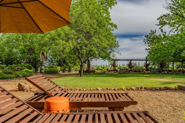 a view of a house with wooden fence
