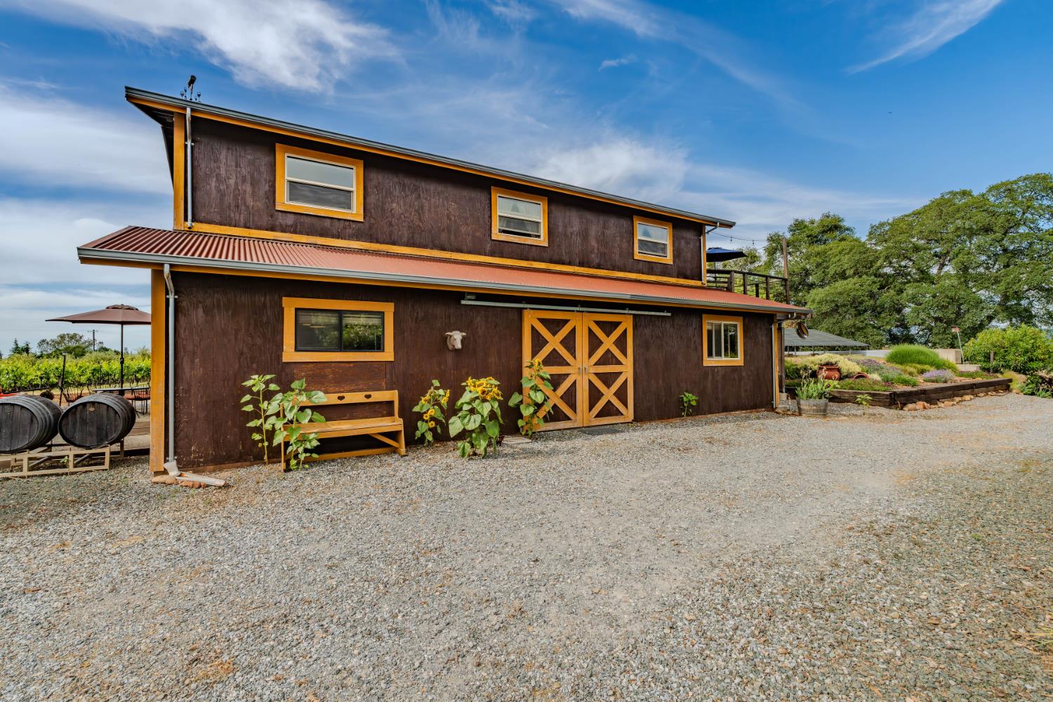 11321 New York Ranch Road Jackson, CA 95642 - Photo 48 of 73 a front view of a house with parking area and garage
