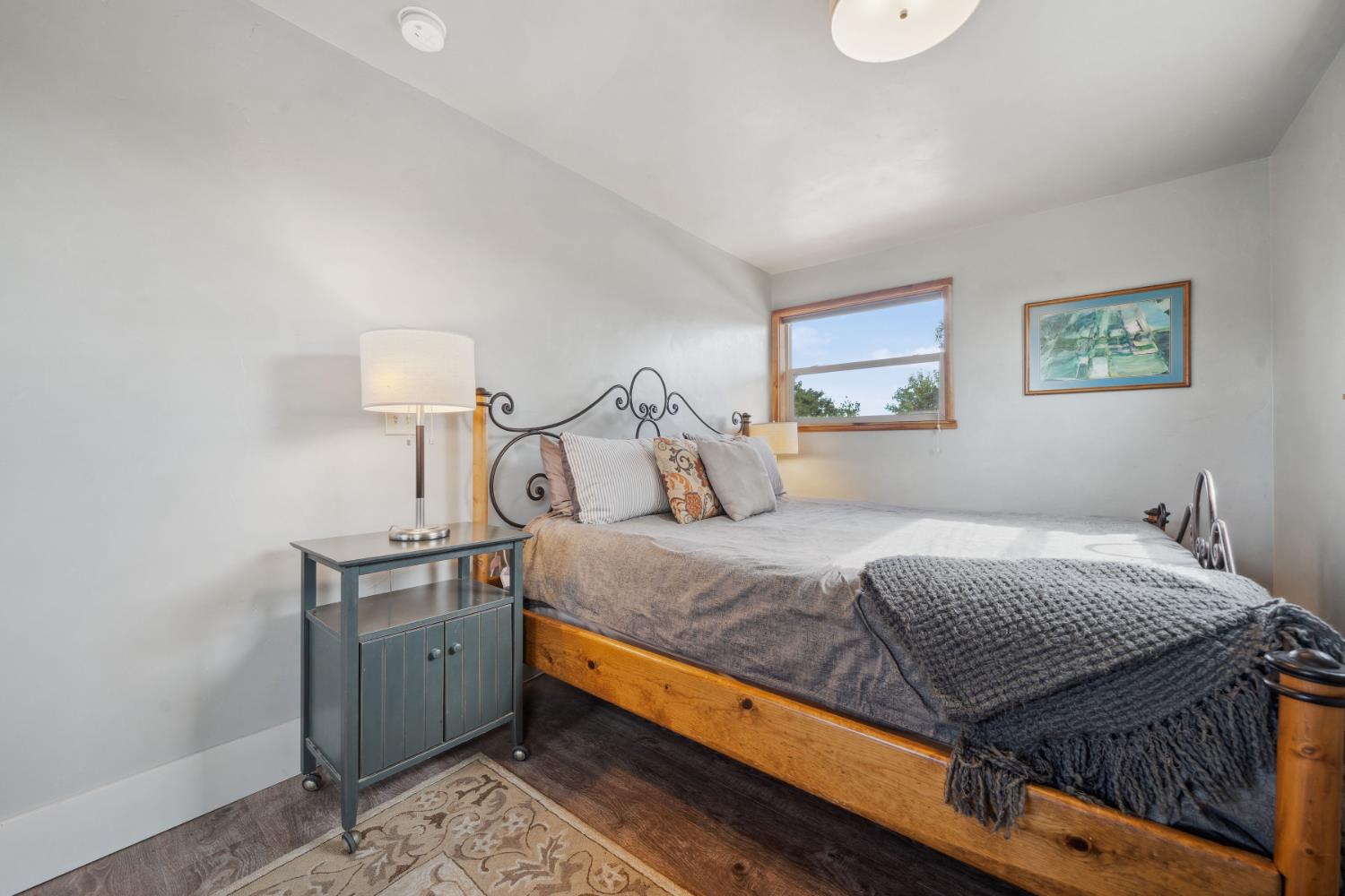 11321 New York Ranch Road Jackson, CA 95642 - Photo 57 of 73 a bed sitting in a bedroom next to a lamp