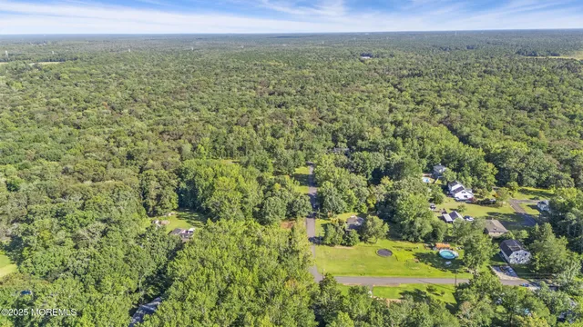 a view of a field with an trees