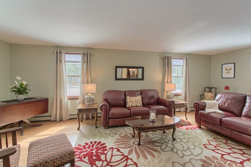 27 Ledge Road Chelmsford, MA 01863 - Photo 11 of 30 a living room with furniture wooden floor and a window
