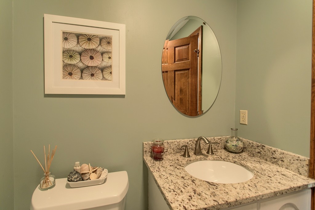 27 Ledge Road Chelmsford, MA 01863 - Photo 15 of 30 a bathroom with a sink and a mirror