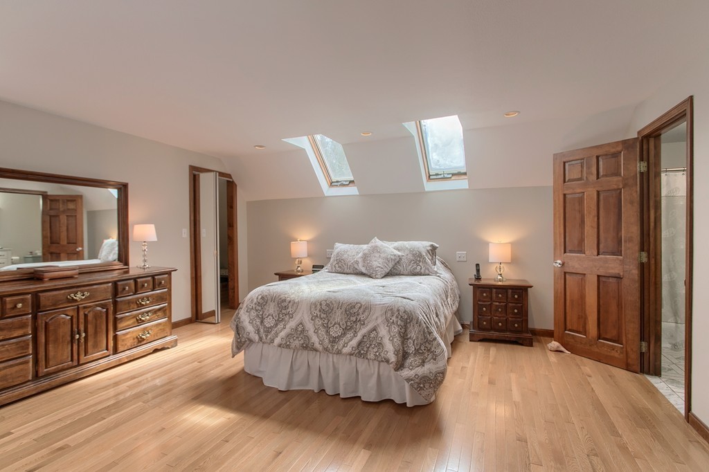 27 Ledge Road Chelmsford, MA 01863 - Photo 17 of 30 a bedroom with a bed and wooden floor