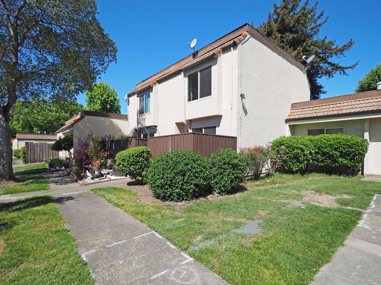 1828 Primavera Court Santa Rosa, CA 95409 - Photo 1 of 1 a front view of a house with a yard
