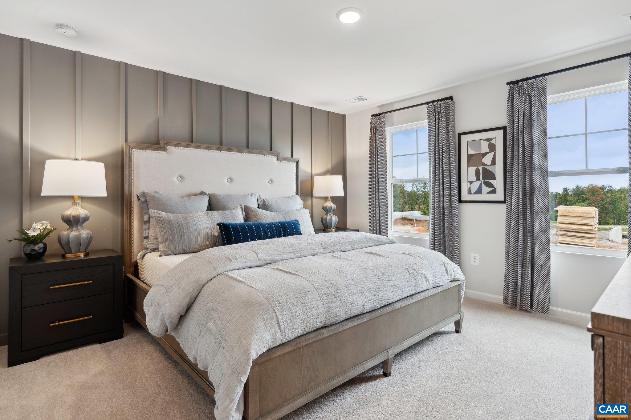 177 Horse Path Drive Palmyra, VA 22963 - Photo 12 of 31 a spacious bedroom with a bed and a lamp