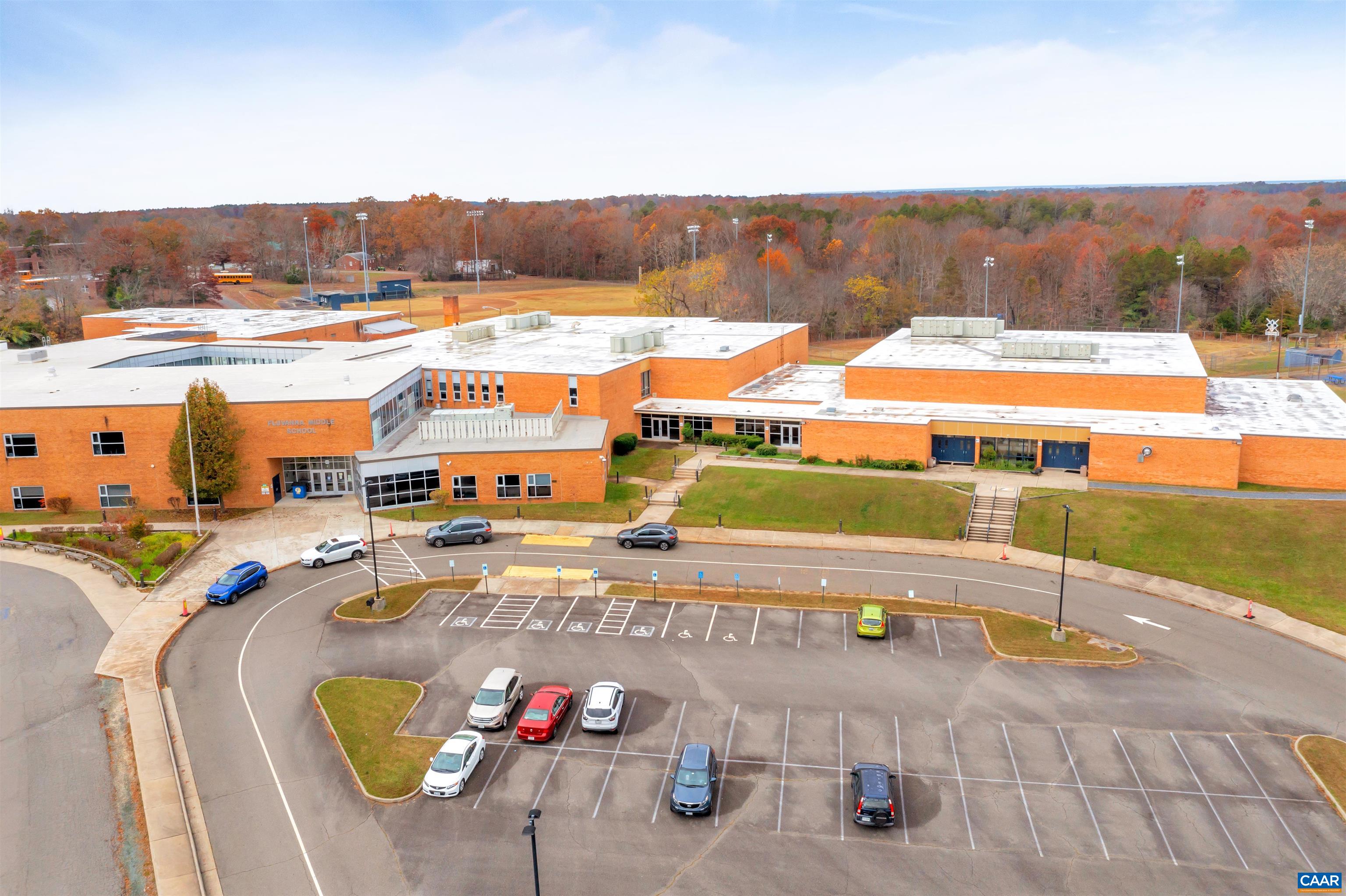 177 Horse Path Drive Palmyra, VA 22963 - Photo 22 of 31 a view of a swimming pool with a table and chairs