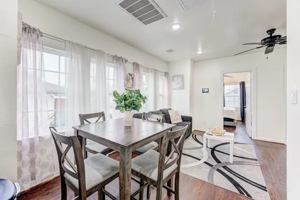 a view of a dining room with furniture and a window