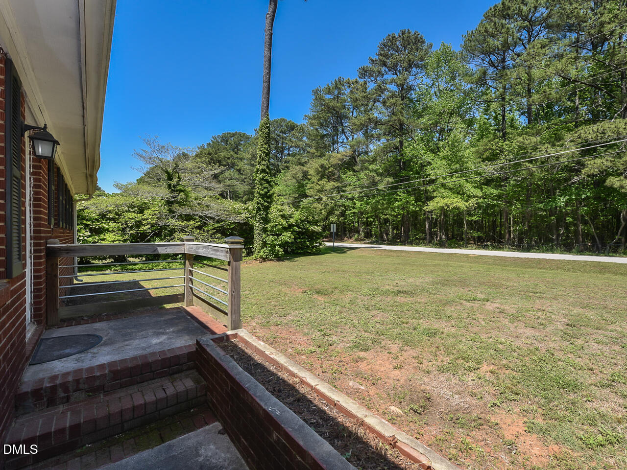 1703 St Patrick Drive Raleigh, NC 27603 - Photo 27 of 29 a view of a backyard with wooden fence